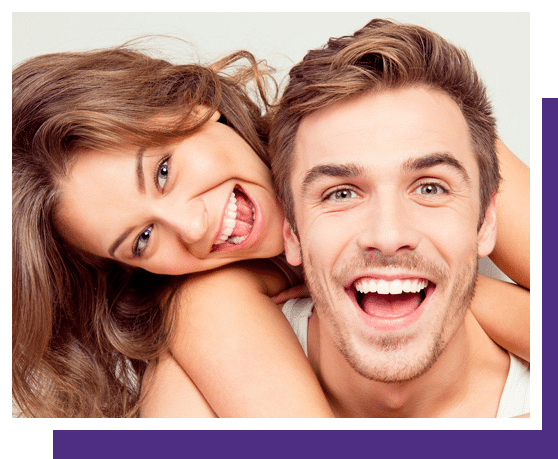 Happy couple smiling together on a dental practice website privacy policy page.