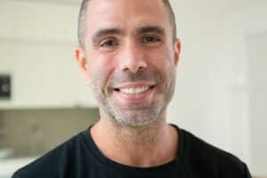 man smiling after cosmetic dental makeover