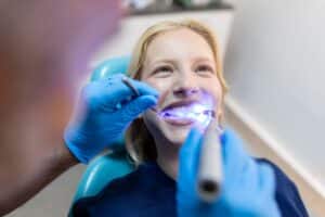 patient getting teeth whitening treatment