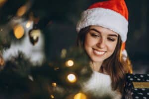 woman decorating Christmas tree