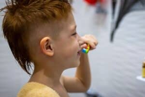 child brushing during summer